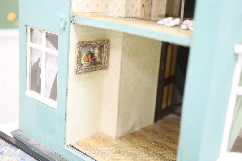 A 1940s dolls house, with contents from Compton Verney Warwickshire, width 63cm height 60cm